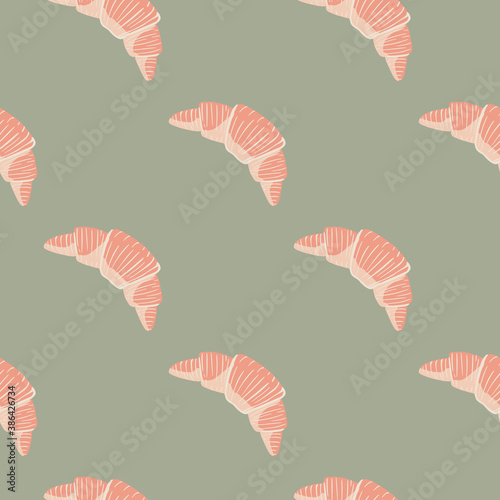 Seamless minimalistic seamless pattern with croissants. France dessert pink ornament on grey background.