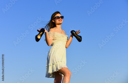 Simply being around. Portrait of the beautiful girl. beach fashion style. Summer outdoor lifestyle. Happy young woman posing over blue sky. pretty young beautiful woman in sunglasses. Summer outfit
