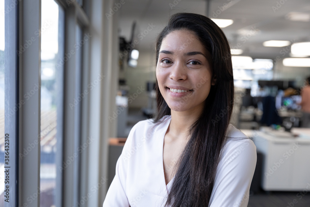 Portrait of businesswoman smiling at modern office Portrait of businesswoman smiling at modern office