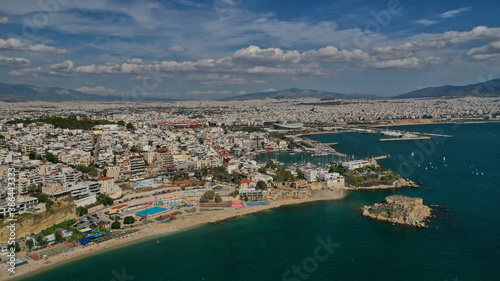 Aerial drone panoramic photo of iconic round port and marina of Zea in the heart of Piraeus with beautiful sky and clouds  Attica  Greece