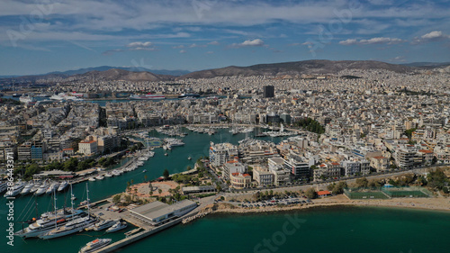 Aerial drone panoramic photo of iconic round port and marina of Zea in the heart of Piraeus with beautiful sky and clouds, Attica, Greece