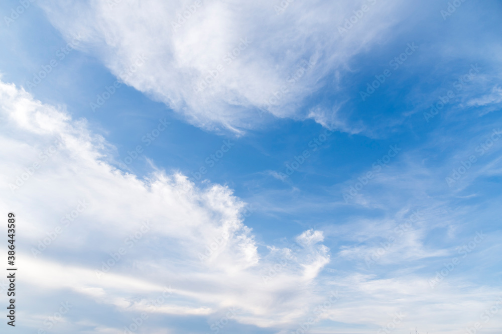 Fototapeta premium Blue sky and white fluffy tiny clouds background and pattern