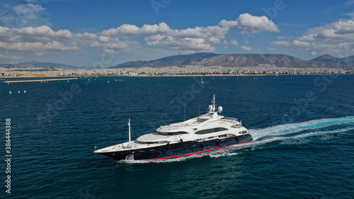 Aerial drone photo of luxury yacht cruising Saronic gulf near famous marina of Zea, Piraeus, Attica, Greece