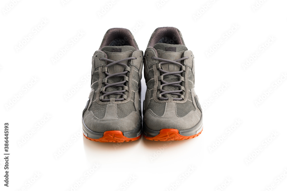 trekking sneakers with red sole, isolated on white trekking sneakers with red sole, isolated on white