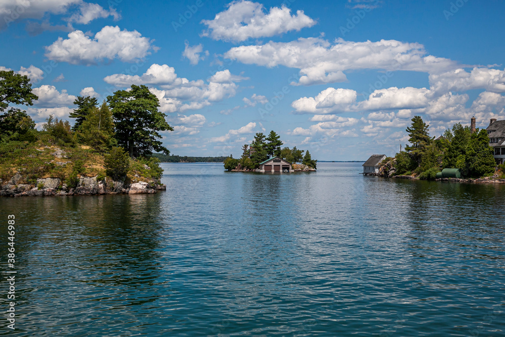 Thousand islands with their cottages along the St Lawrence river and US Canada border
