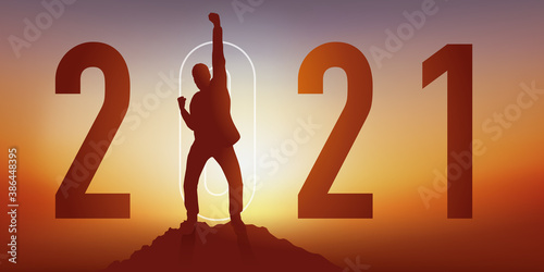 Carte de voeux 2021 montrant un homme satisfait en levant le poing en signe de la victoire après avoir atteint son objectif en arrivant au sommet d’une montagne.