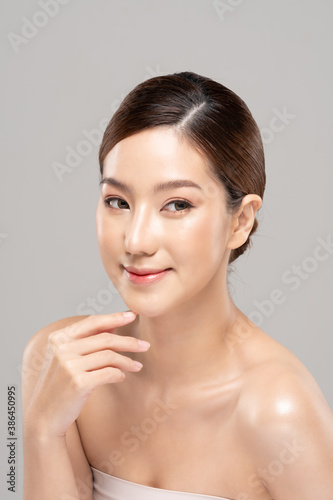 Beautiful Young Asian Woman Looking While Touching Chin feeling so happy and cheerful with healthy Clean and Fresh skin on white ,Plastic Surgery chin,Beauty Cosmetics and spa facial treatment Concept