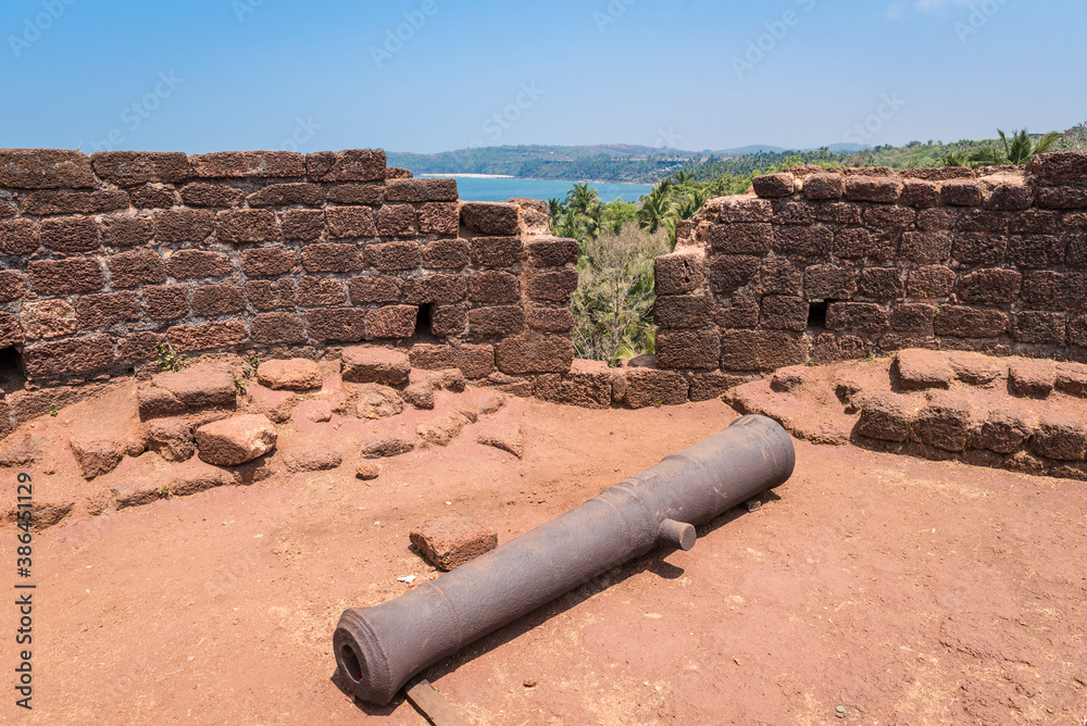 Old cannon on the tower of the former Portuguese fortress of Cabo De Rama in Goa, India Old cannon on the tower of the former Portuguese fortress of Cabo De Rama in Goa, India