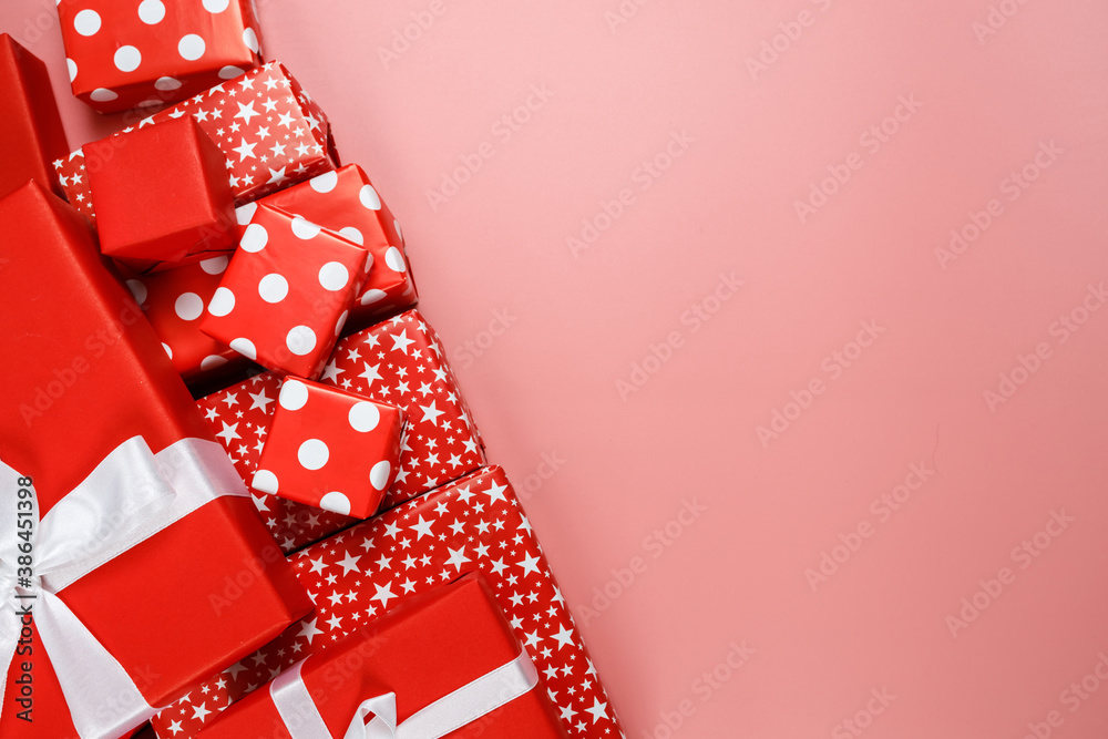 Obraz premium Frame of red gift boxes on pink background with copy space for text 11.11 single's day sale.