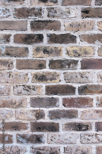 Background of wide old brick wall texture. Home or office design backdrop. Close-up texture. 