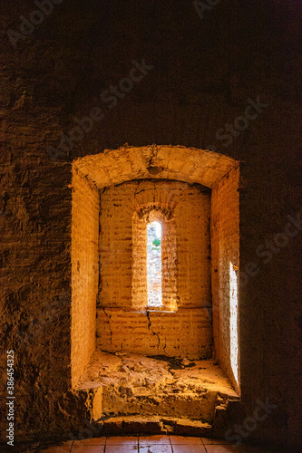 Light entering through medieval brick window in tower interior