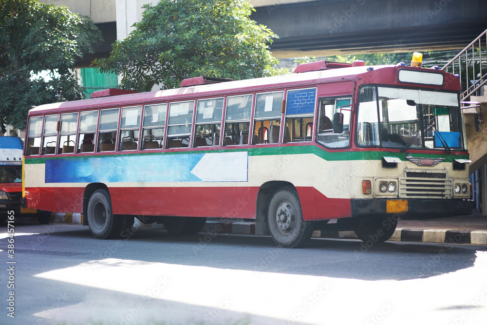 Thai public bus for transportation or travel on traffic road scenr Thai public bus for transportation or travel on traffic road scenr