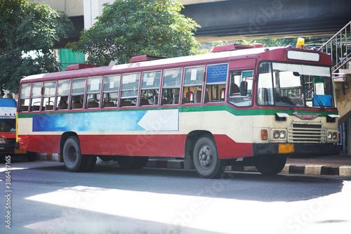 Thai public bus for transportation or travel on traffic road scenr