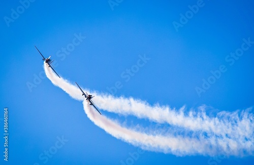 two jets with contrails in airshow photo