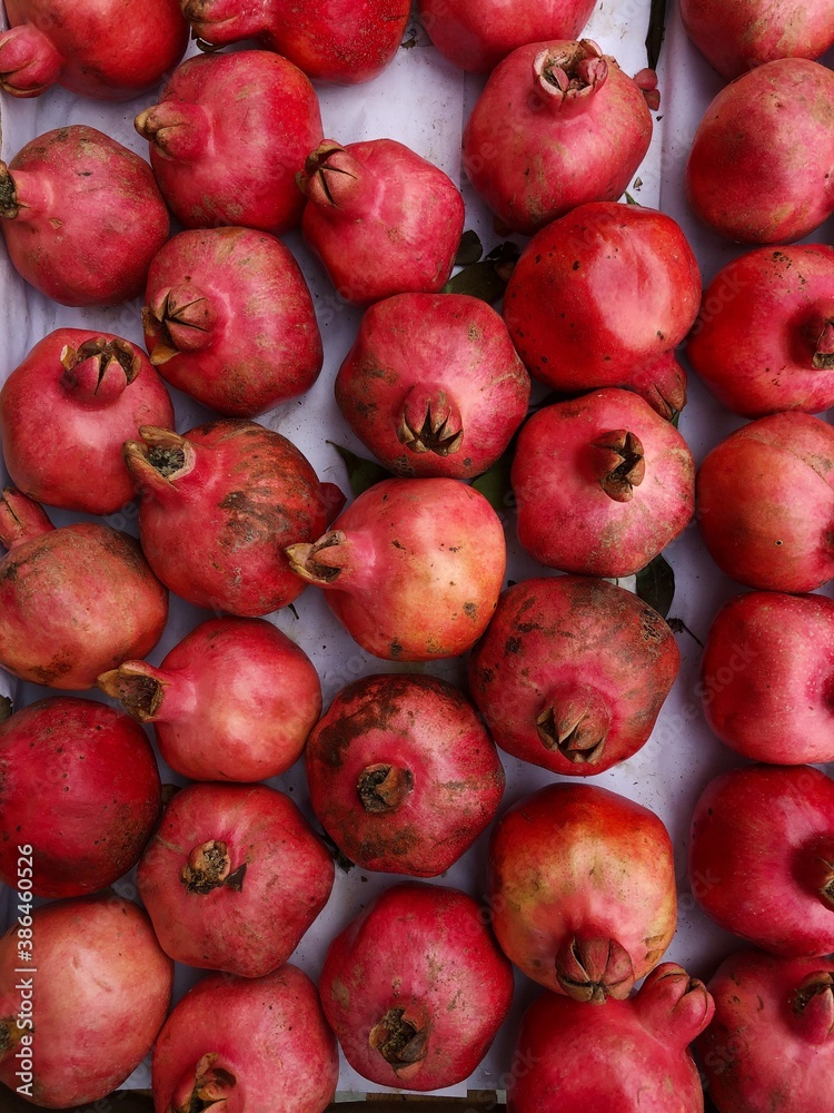 Ripe juicy pomegranates on the market macro Ripe juicy pomegranates on the market macro