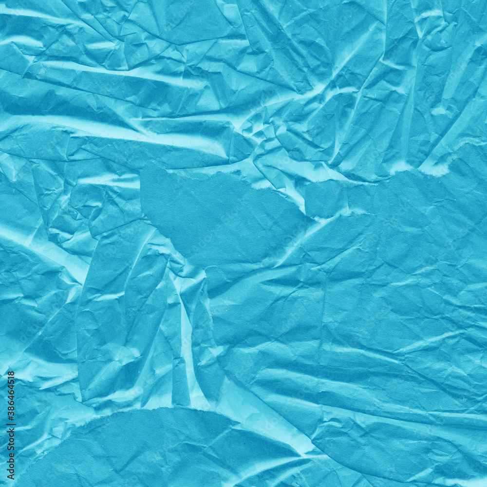 Obraz premium Blue vintage and old looking crumpled paper background. Retro cardboard texture. Grunge paper for drawing. Ancient book page. Present wrapping.