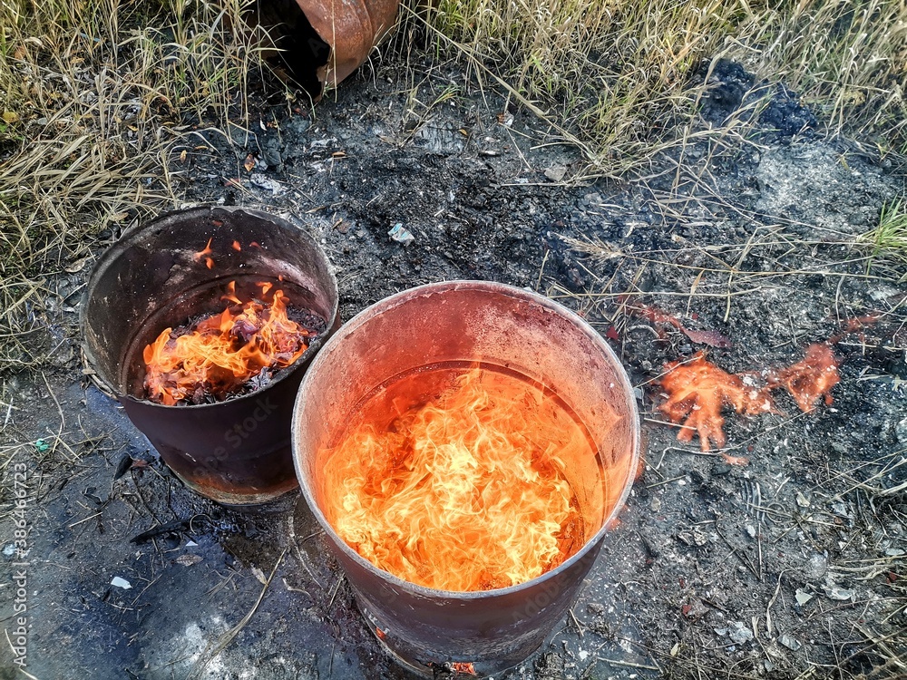 Fire in an old barrel on the street. Fire in an old barrel on the street.