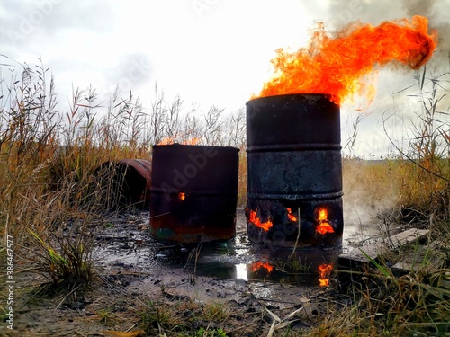 Fire in an old barrel on the street.