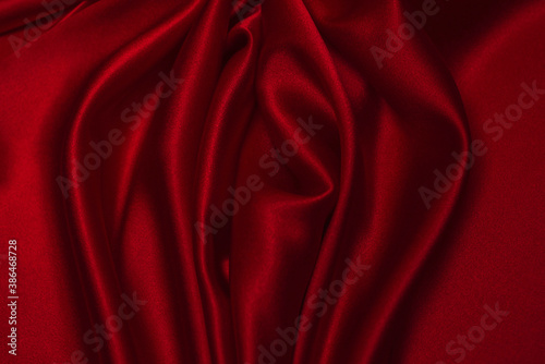 Red silk or satin luxury fabric texture can use as abstract background.