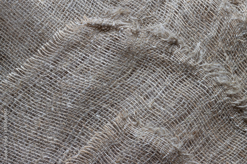 Texture of crumpled natural burlap close-up.