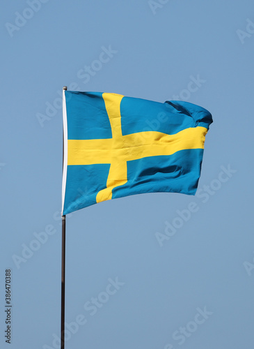 Swedish flag flying on flagpole