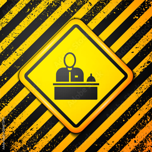 Black Receptionist standing at hotel reception desk icon isolated on yellow background. Warning sign. Vector.