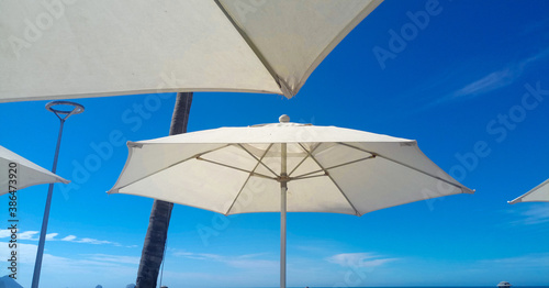 beach umbrella and blue sky © Fabiola Segovia 
