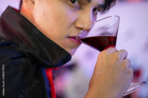 young Asian woman wearing costume in Halloween festival party