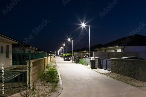 street in a residential area with modern street lights