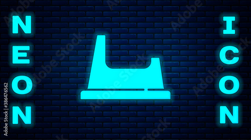 Glowing neon Baby potty icon isolated on brick wall background. Chamber pot. Vector.