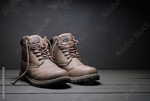 Men's winter boots gray and black background
