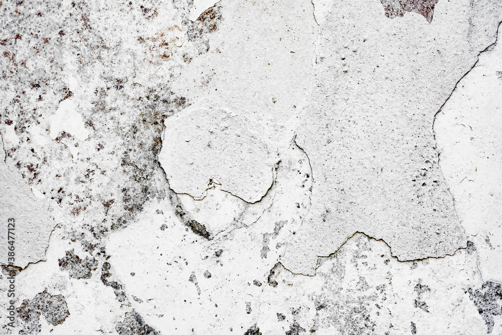 Texture of a concrete wall with cracks and scratches which can be used as a background