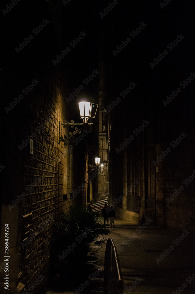 Romanic couple walking down the night street in old Europe