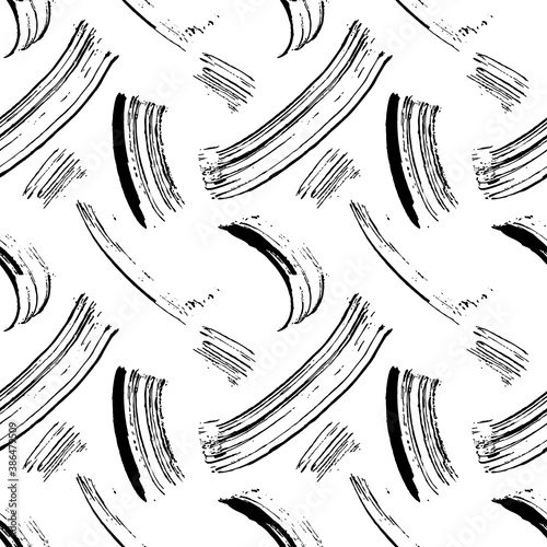 Seamless pattern of mascara strokes. Black paint brushes on white background. Abstract background