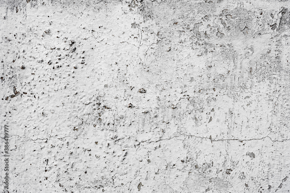 Texture of a concrete wall with cracks and scratches which can be used as a background Texture of a concrete wall with cracks and scratches which can be used as a background