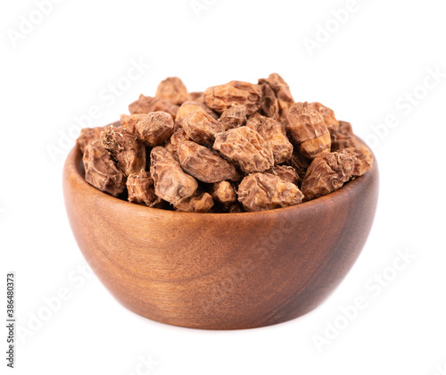 Tigernuts isolated on white background. Chufa nuts or tiger nuts in wooden bowl.