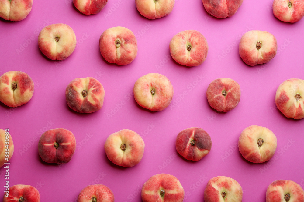 Fresh donut peaches on pink background, flat lay