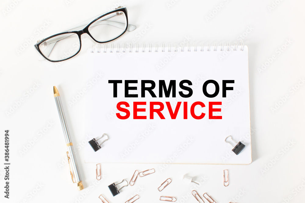 text TERMS OF SERVICE in a magnifying glass, office concept, business concept, Finance