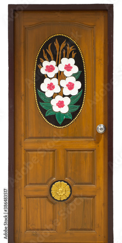 Carved wooden doors with twig patterns, leaves, and white flowers