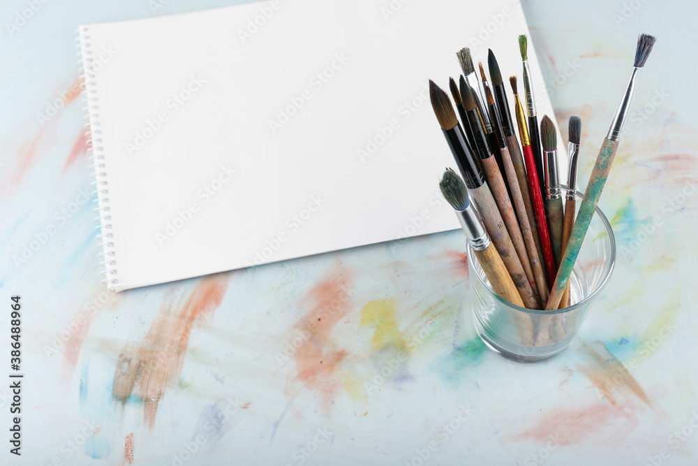 background of art brushes and paper