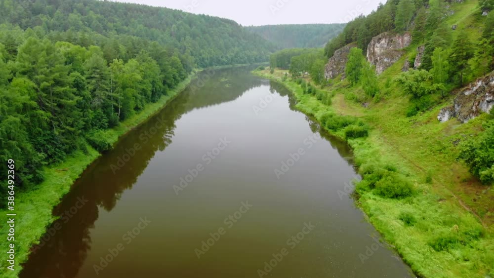 The nature of the Southern Urals with a river and mountains. The nature of the Southern Urals with a river and mountains.