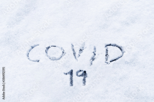Covid 19 winter.Covid 19 written in the snow. Concept covid-19 pandemic in winter and christmas 2020.