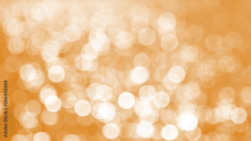 Abstract orange light background with white bokeh