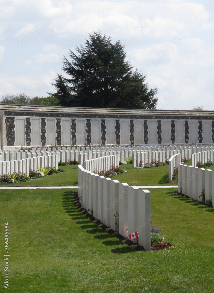 British and Commonwealth WW1 graves, Tyne Cot Cemetery, Belgium, with memorial wall to the missing in background