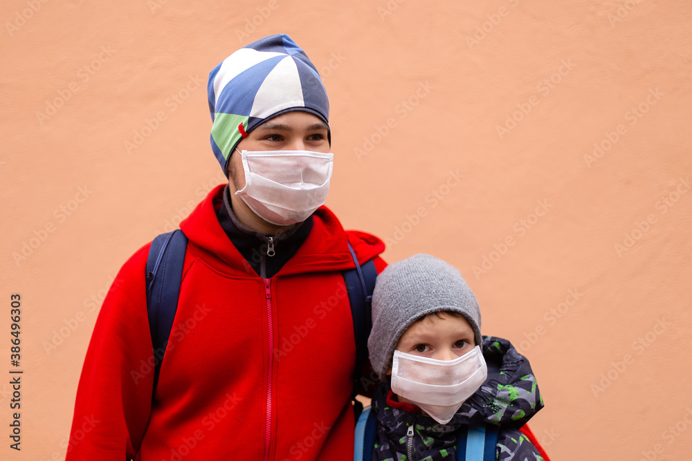 schoolchildren in protective masks in the street schoolchildren in protective masks in the street