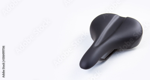 Bicycle saddle on white background, close-up view, studio photo. copyspace for text.