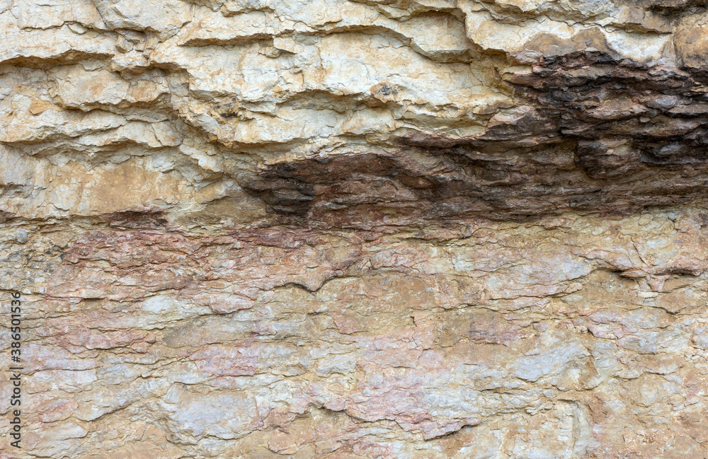 Natural mountain stone,a section of rock texture on a Sunny day.