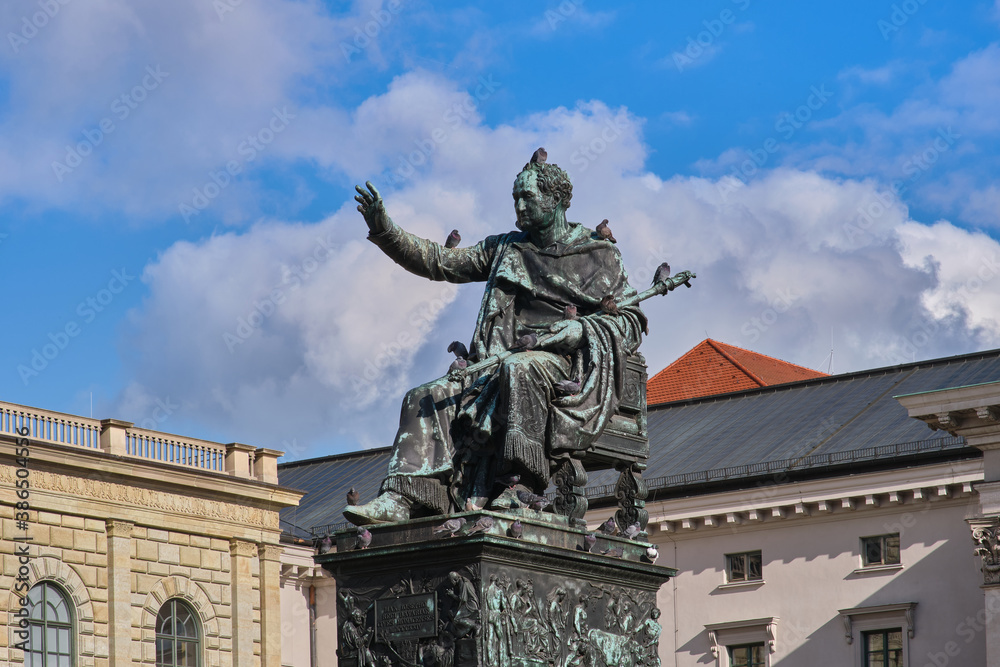 Bronze statue of the king Maximilian Joseph in Munich, Germany and the birds sitting on it