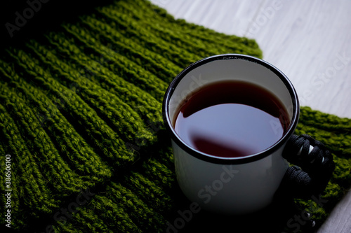 a cup of tea on a light wooden background