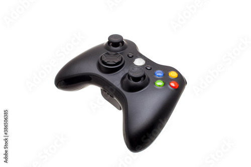 game remote gamepad with buttons and analog control of video games, entertainment device wireless joystick isolated on white background side view, nobody.